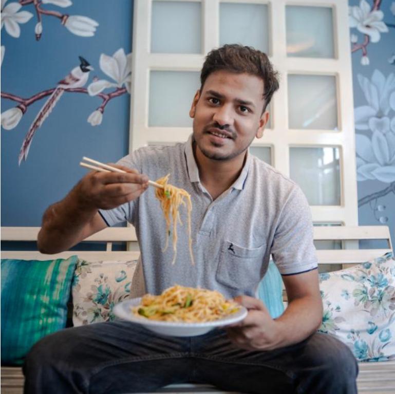 Deep Guha, founder of Jaamun, enjoying a plate of food