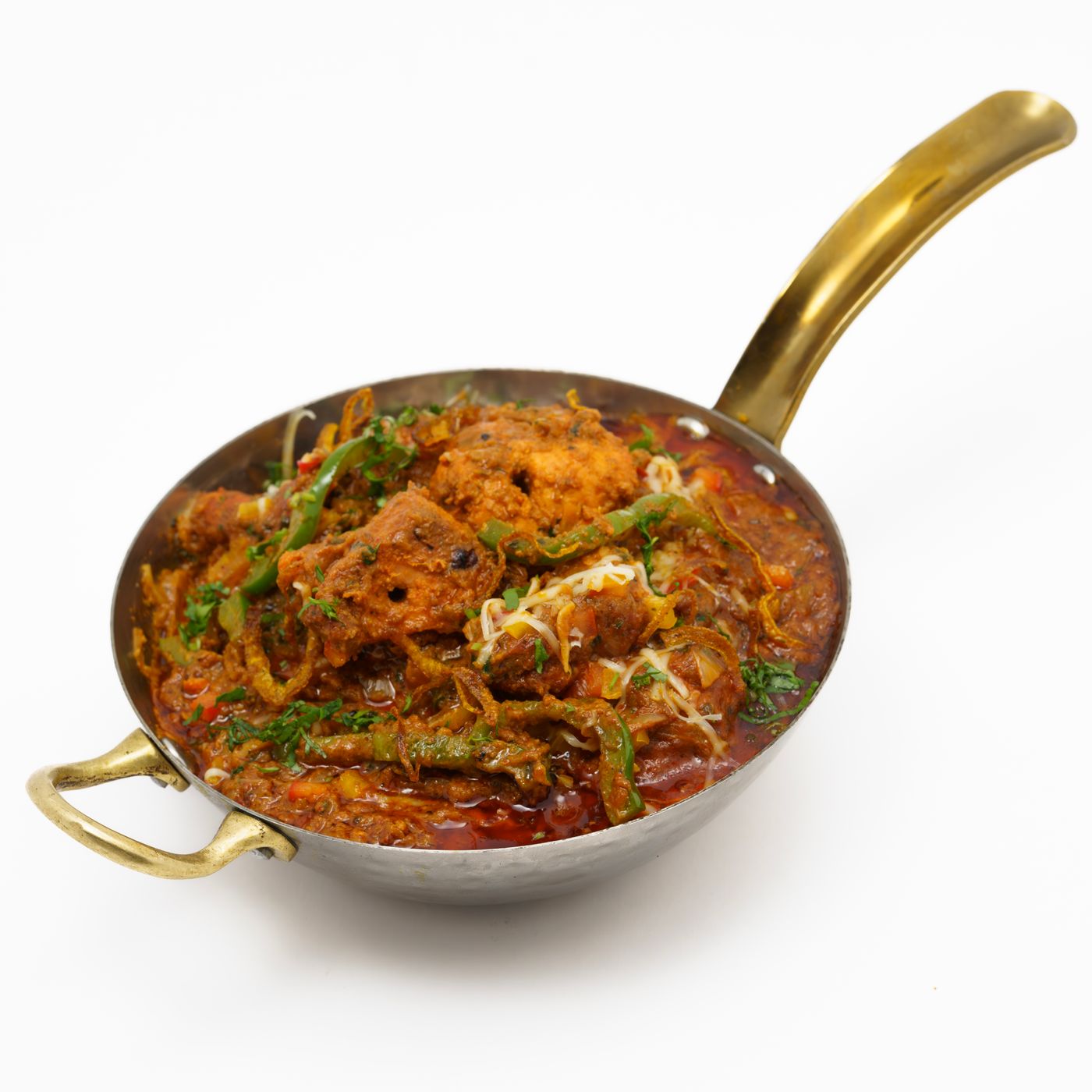 Rich Indian curry served in a traditional kadai